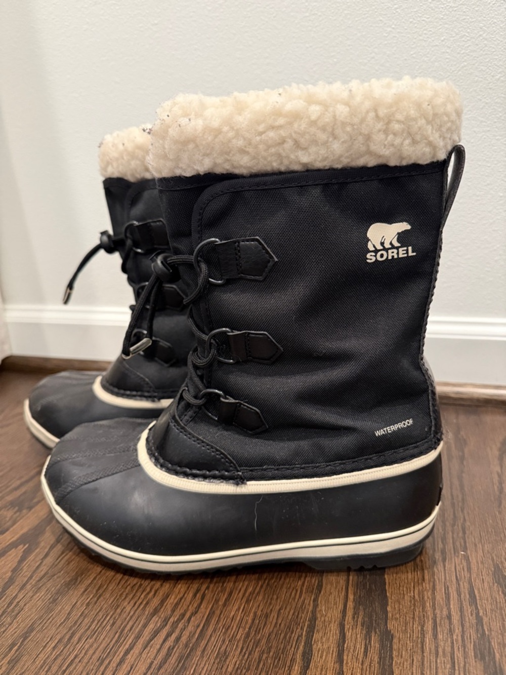 Sorel Kids Black Winter Boots with Cream Faux Shearling Cuff
